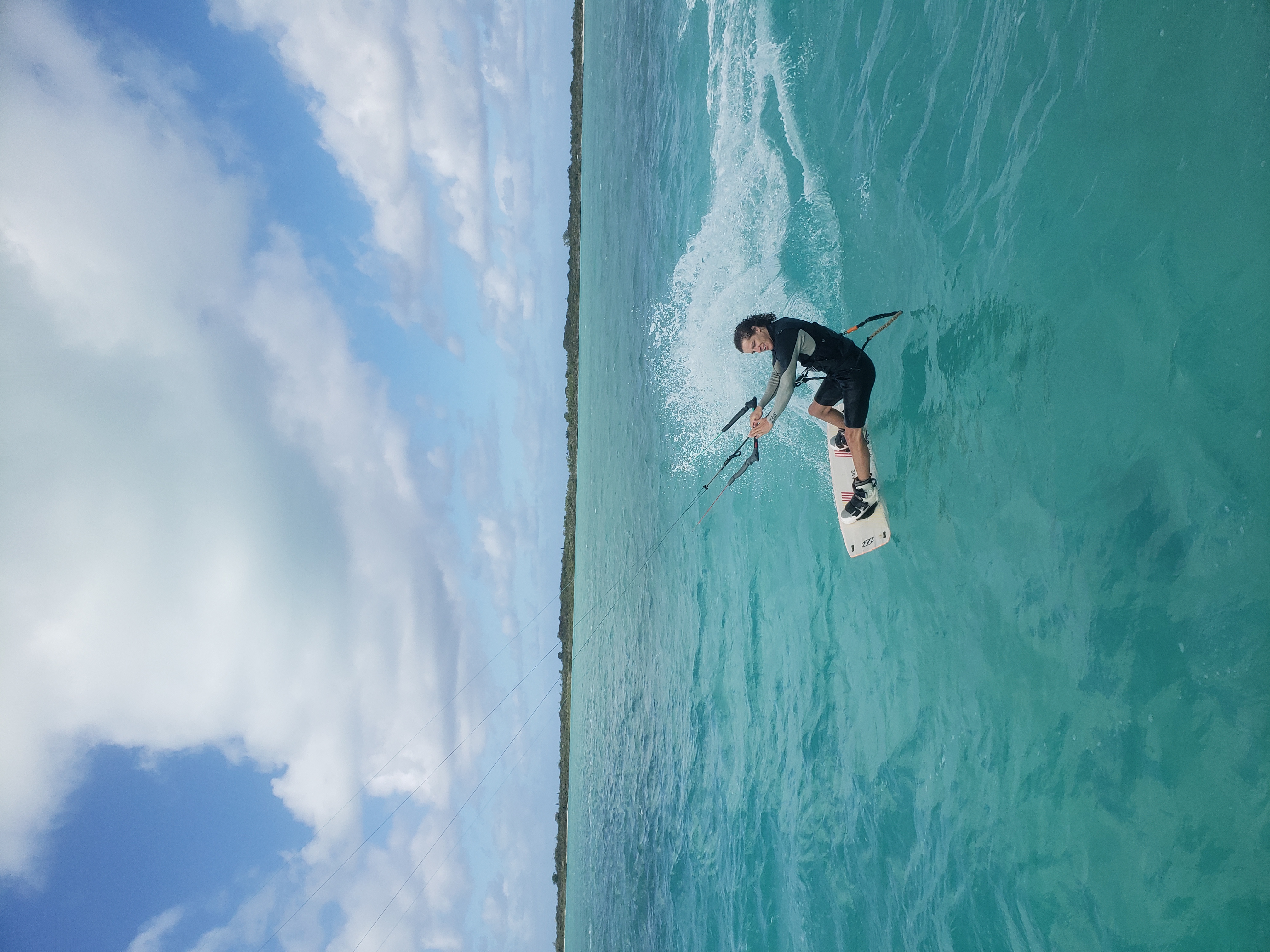 Kiteboarder on turquoise water