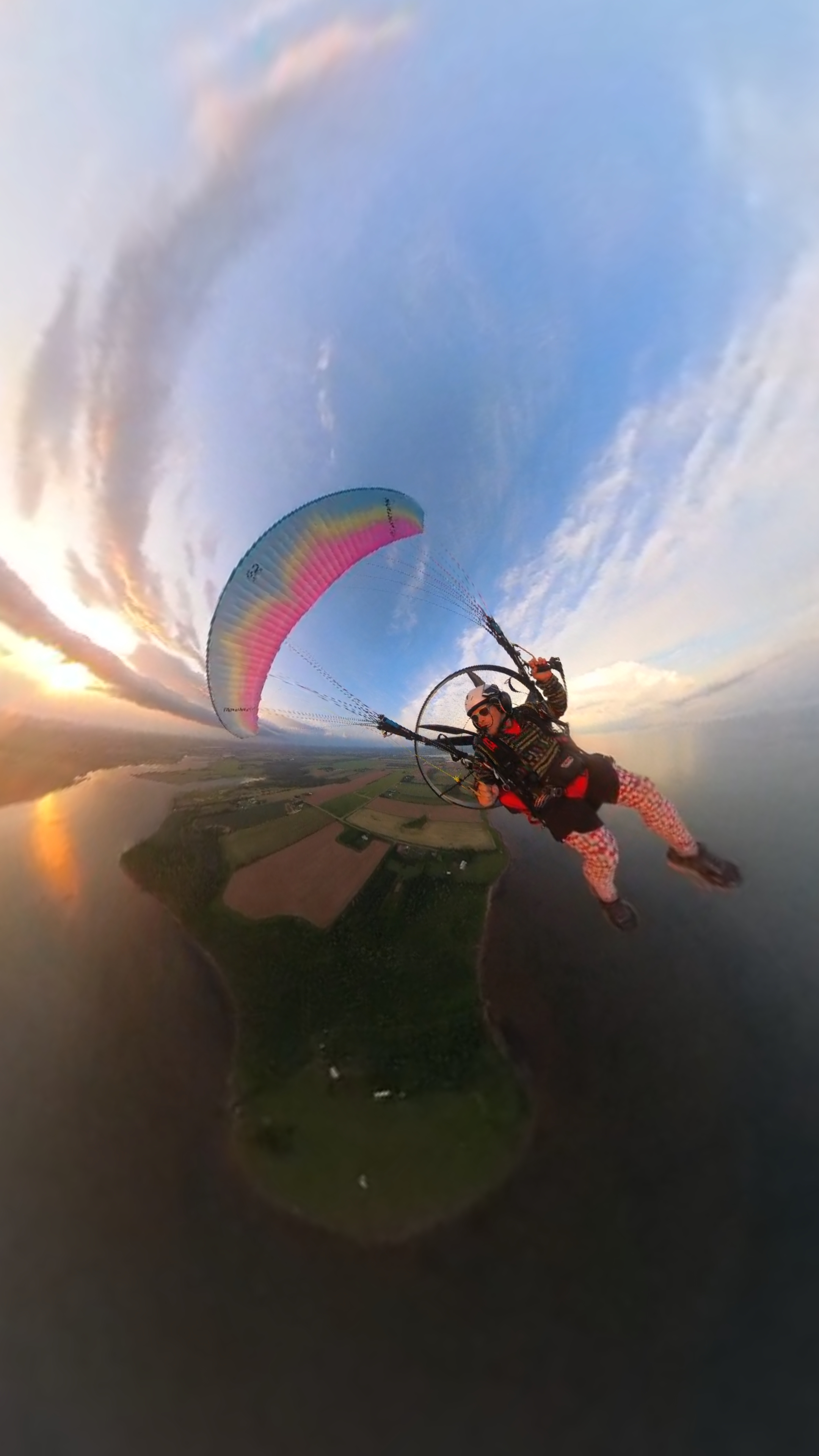 Paramotor flight over landscape